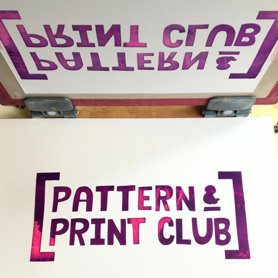 Adult and child hands creating colourful paper collages at a family arts and crafts workshop